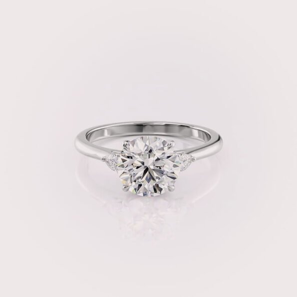 2.5ct round cut lab diamond three-stone engagement ring