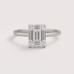 Emerald cut 6 carat lab diamond solitaire ring in 18K yellow gold – front view on matte background