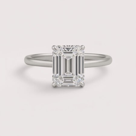 Emerald cut 6 carat lab diamond solitaire ring in 18K yellow gold – front view on matte background