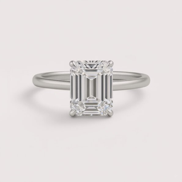 Emerald cut 6 carat lab diamond solitaire ring in 18K yellow gold – front view on matte background