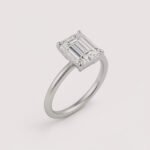 Emerald cut 6 carat lab diamond solitaire ring in 18K yellow gold – front view on matte background