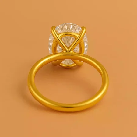 Back view of oval cut 5.5ct lab diamond solitaire ring in yellow gold with elegant cathedral mount