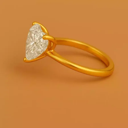 Side angle of heart shaped 5ct lab diamond solitaire ring in 18K yellow gold – elegant and modern ring design