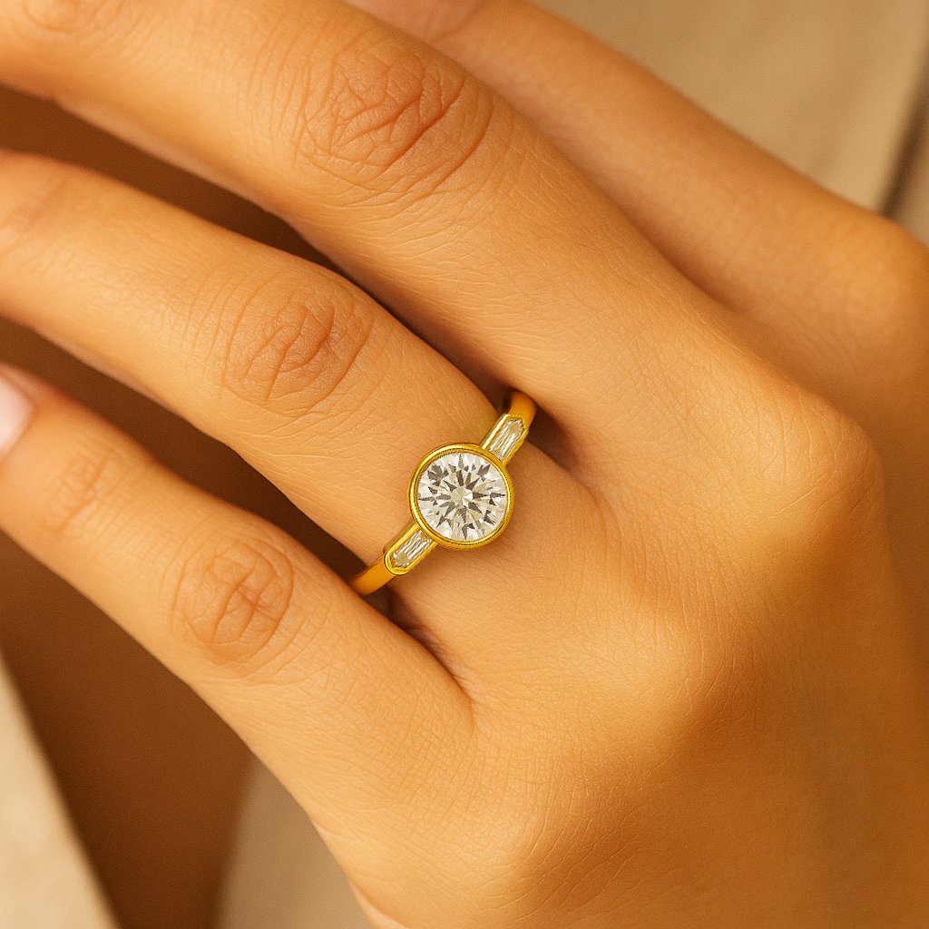 UN1015 (5) Round cut diamond three-stone ring with yellow gold band shown on a woman's hand