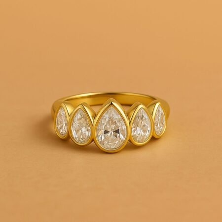 Five-stone pear cut diamond band in yellow gold bezel setting, front view with symmetrical teardrop design.