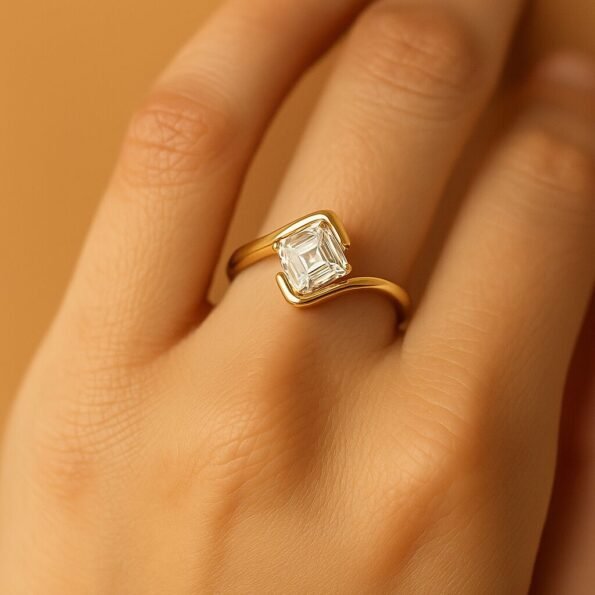 Asscher cut lab-grown diamond ring showcased on a hand, highlighting its modern bypass gold band