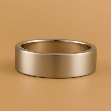 Sleek and polished plain men's wedding band in 18K White Gold with brushed finish.