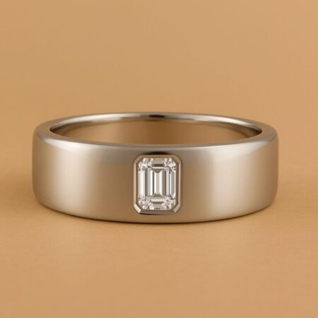 Men's flat 18K White Gold band with bezel-set emerald-cut lab-grown diamond center.