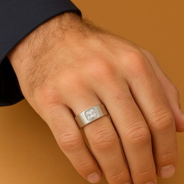 Men’s 18K White Gold ring featuring a radiant-cut lab-grown diamond, worn on hand against a tan background