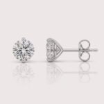 Round cut lab-grown diamond stud earrings in three-prong setting on white gold – front view