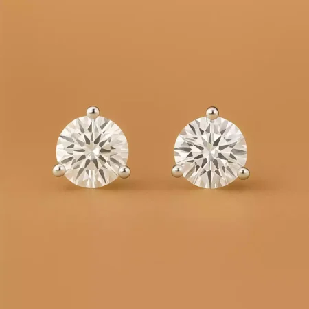 Round cut lab-grown diamond stud earrings in three-prong setting on white gold – front view