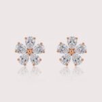 Pear-cut diamond flower cluster earrings in white gold – symmetrical five-petal floral design