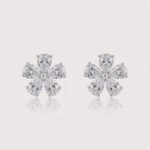 Pear-cut diamond flower cluster earrings in white gold – symmetrical five-petal floral design