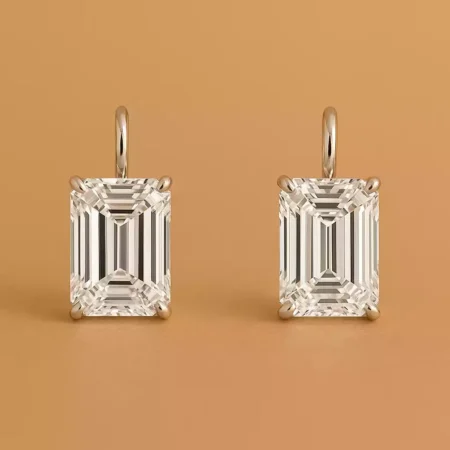 Pair of emerald cut lab-grown diamond drop earrings in white gold with four-prong setting – front view