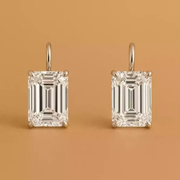 Pair of emerald cut lab-grown diamond drop earrings in white gold with four-prong setting – front view