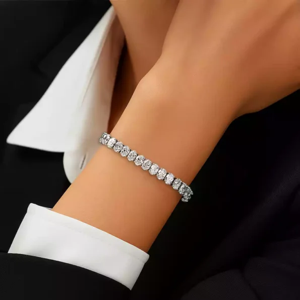 Elegant oval diamond tennis bracelet worn on wrist – close-up showcasing lab-grown diamonds in white