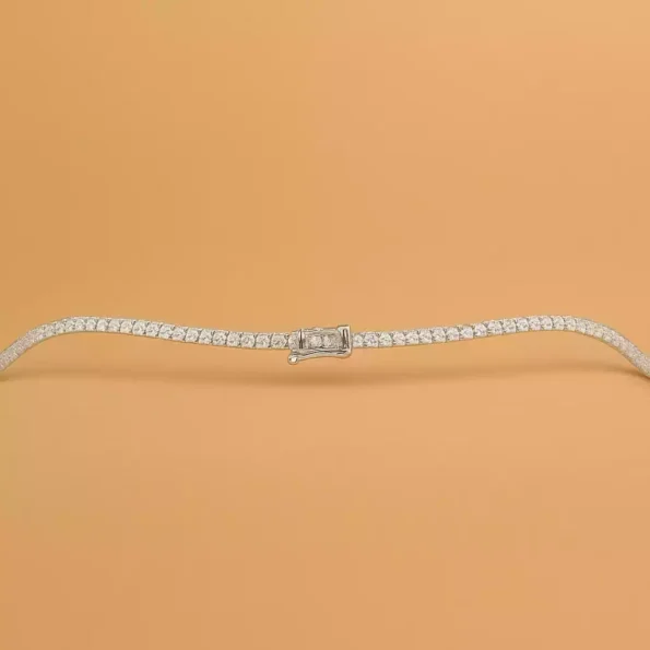 Lab-grown diamond tennis necklace in white gold with emerald-cut center stone and secure clasp – flat layout