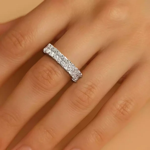 Radiant cut diamond eternity band on finger – elegant white gold ring with continuous lab-grown diamonds