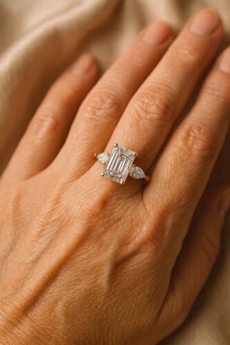 Click to view full screen 2.31ct Emerald Cut E-F VS1 IGI Certified Lab Diamond Engagement Ring in 14K Gold – Three Stone Setting photo review