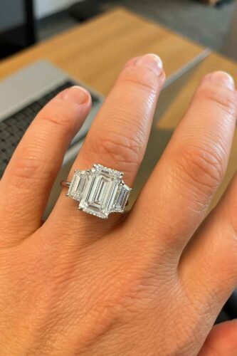 Click to view full screen 8.05ct Emerald Cut Lab Grown Diamond Three Stone Engagement Ring with Trapezoid Side Stones in 10K/14K/18K Gold – IGI Certified photo review