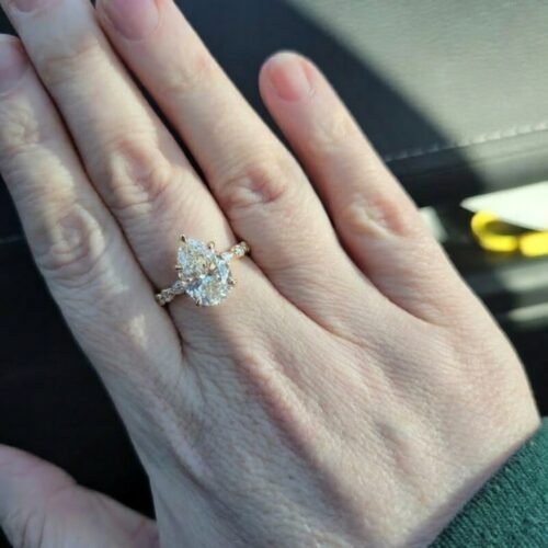 Click to view full screen Pear Cut 3CT F Color VS1 IGI Lab Diamond Hidden Halo Engagement Ring in 14K White Gold – Side Marquise & Round Diamonds photo review